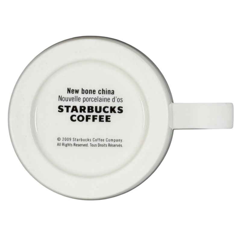 Bottom view of 2009 Starbucks vintage embossed siren logo mug showing New bone china stamp and Starbucks Coffee mark