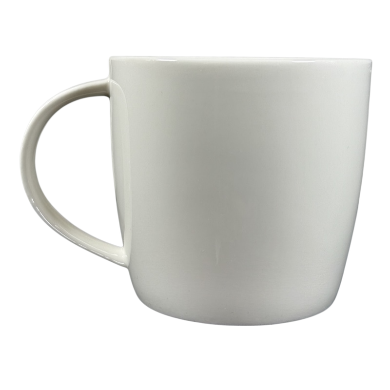 2009 Starbucks vintage embossed siren logo mug plain white ceramic side view with handle left on black background