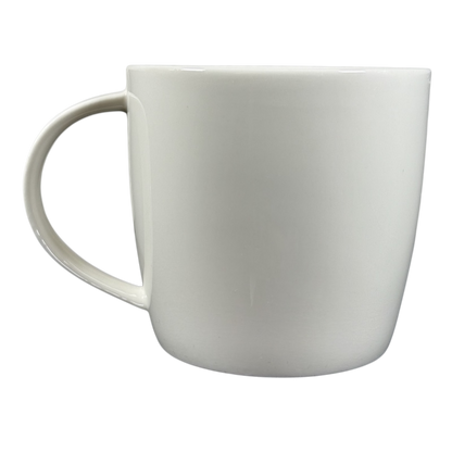 2009 Starbucks vintage embossed siren logo mug plain white ceramic side view with handle left on black background