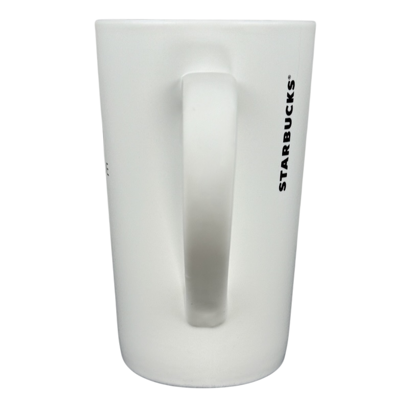 2011 vintage Starbucks 16 Grande mug white tall ceramic mug with vertical black Starbucks logo and handle on black background