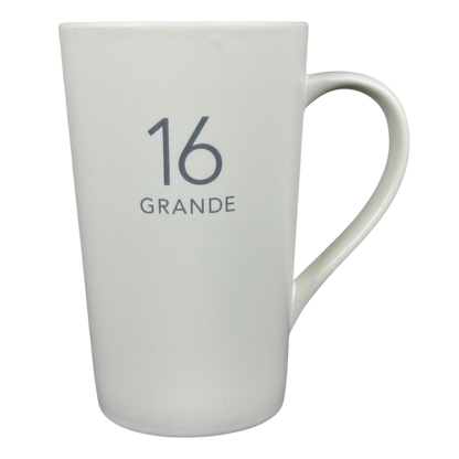 White tall ceramic 2011 vintage Starbucks 16 Grande mug with gray 16 GRANDE print and curved handle on right