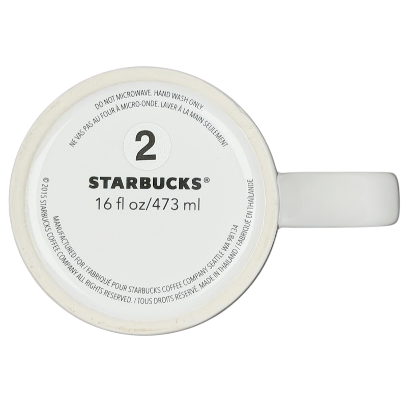 Bottom view of 2015 Starbucks cat yarn collectible mug showing size and care instructions
