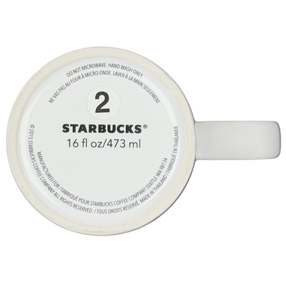 Bottom view of 2015 Starbucks cat yarn collectible mug showing size and care instructions