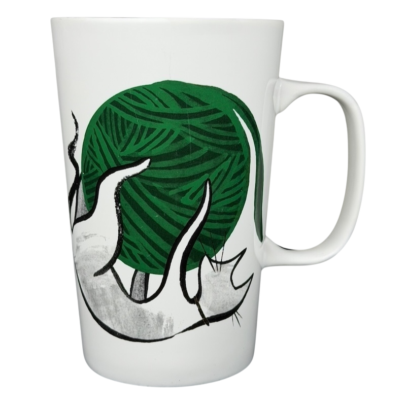 2015 Starbucks cat yarn collectible mug featuring a green yarn ball design