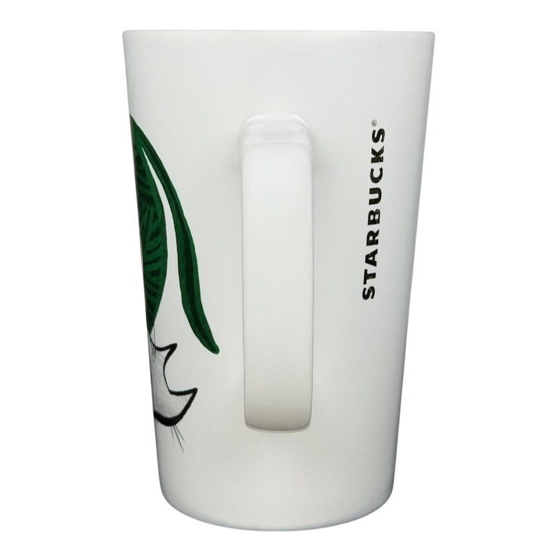2015 Starbucks cat yarn collectible mug featuring a playful feline design on a white background