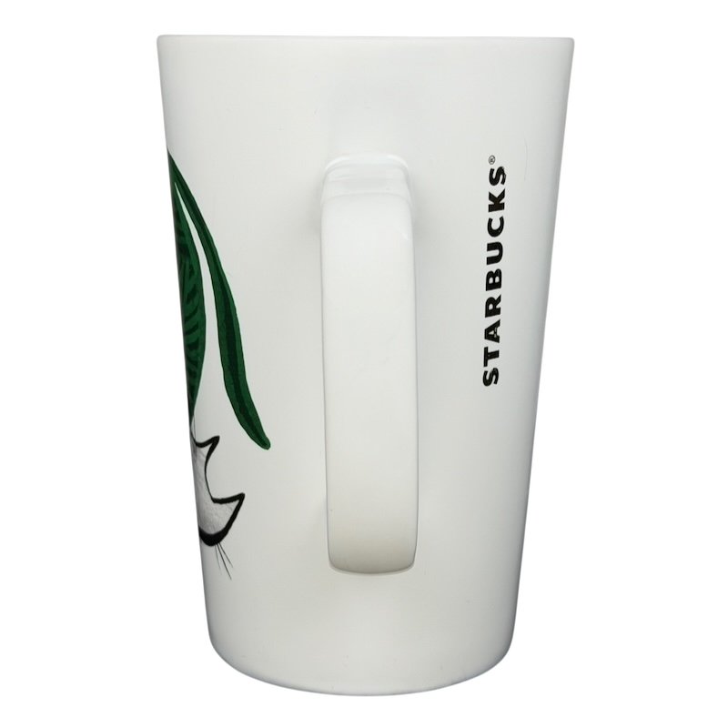 2015 Starbucks cat yarn collectible mug with a cat illustration and green accents