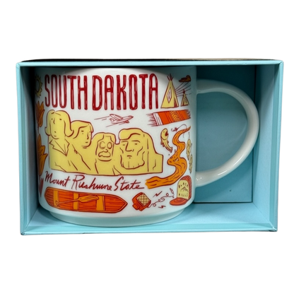 2018 Starbucks South Dakota Collectible mug featuring Mount Rushmore and local icons in a blue box