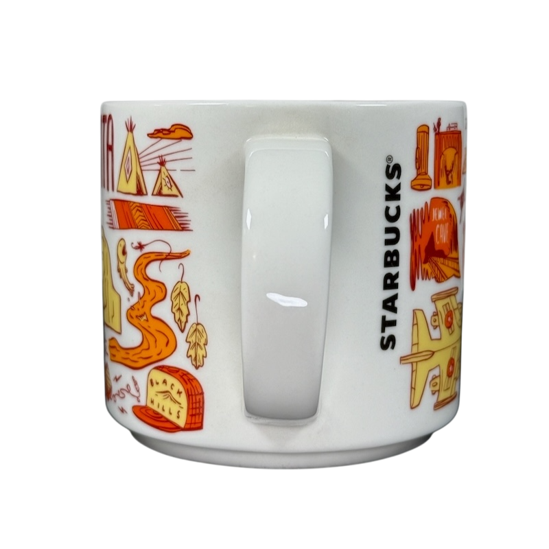 2018 Starbucks South Dakota Collectible mug with orange and yellow state-themed illustrations and Starbucks logo