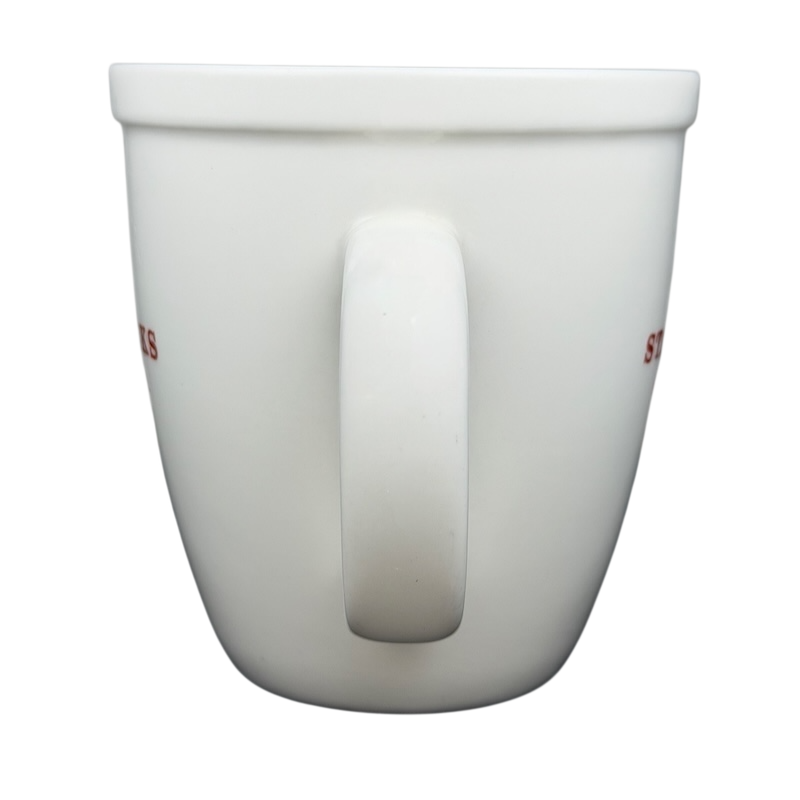 Starbucks Abbey 2007 red lettering holiday mug with a smooth white finish