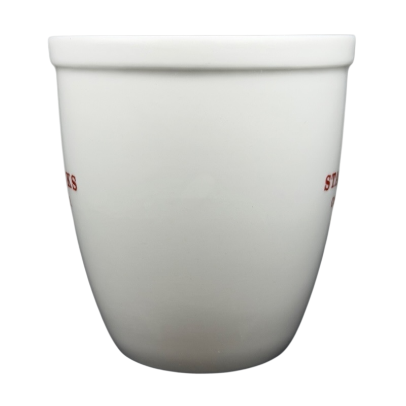 Starbucks Abbey 2007 red lettering holiday mug featuring a simple white design