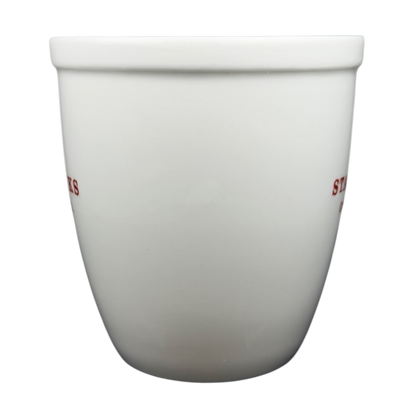 Starbucks Abbey 2007 red lettering holiday mug featuring a simple white design