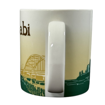 Abu Dhabi Starbucks mug 2014 with city skyline and bridge design in beige and green colors