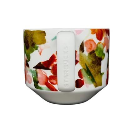 Starbucks Artisan Series collectible mug featuring a vibrant floral design in shades of green and pink