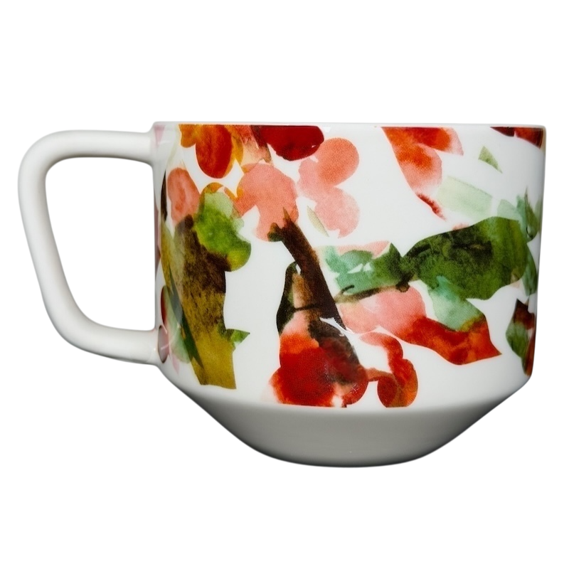 Starbucks Artisan Series collectible mug featuring a colorful floral design on a sleek white base