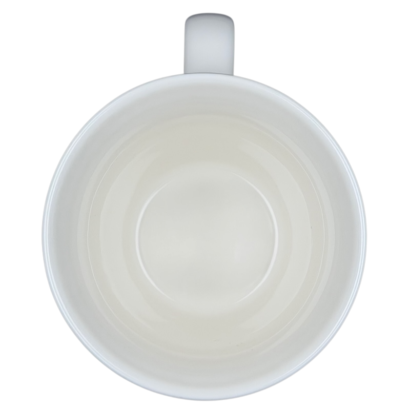 Top view of the Starbucks Barista Abbey ESTD 1971 Mug 2001, showcasing its simple white interior design