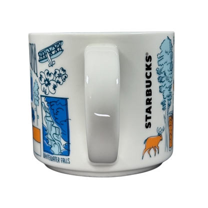 Starbucks Been There North Carolina mug with blue and orange state-themed illustrations and white handle