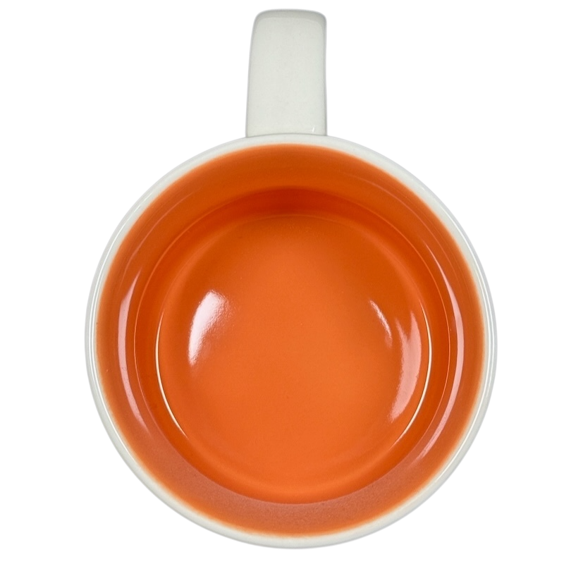 Top view of Starbucks Been There Series mug Texas with bright orange interior and white handle