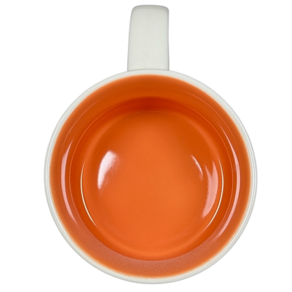 Top view of Starbucks Been There Series mug Texas with bright orange interior and white handle