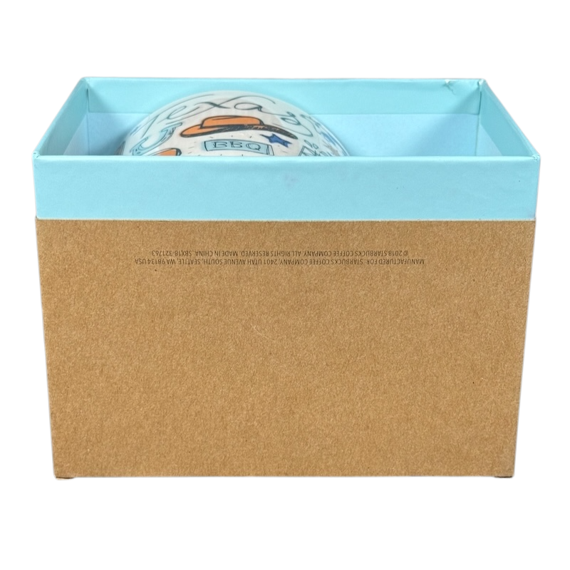 Starbucks Been There Series mug Texas partially visible in a blue and brown gift box