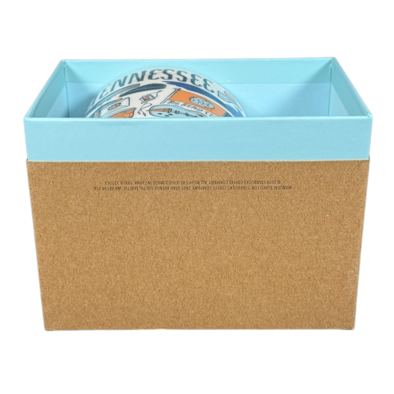 Starbucks Been There Tennessee mug partially visible inside blue and brown gift box