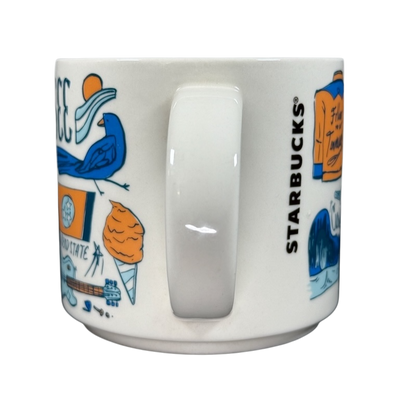 Starbucks Been There Tennessee mug with illustrated Tennessee-themed designs in blue and orange