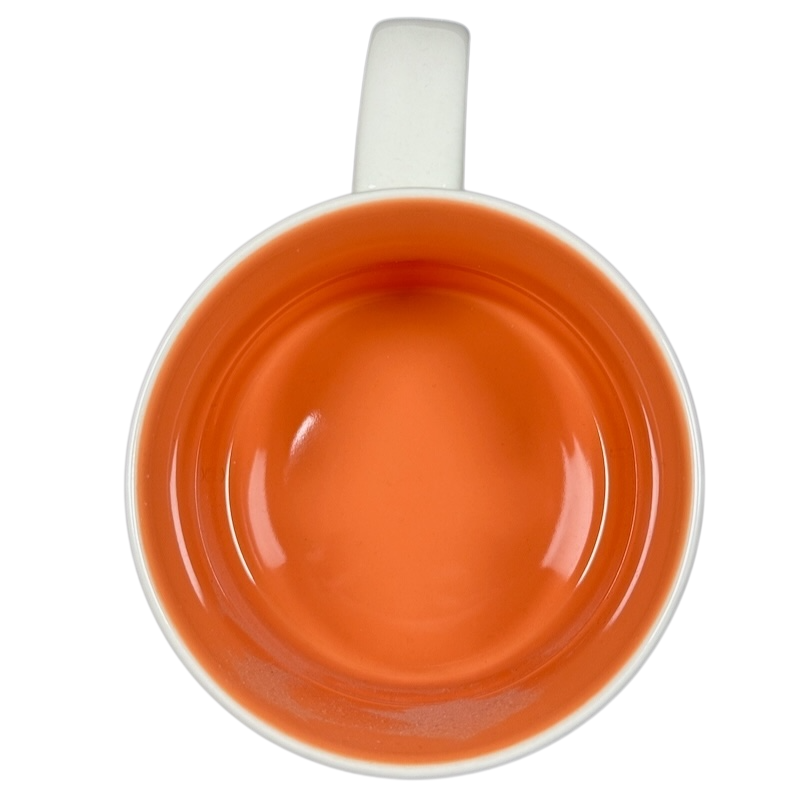 Top view of Starbucks Been There Tennessee mug with orange interior and white handle