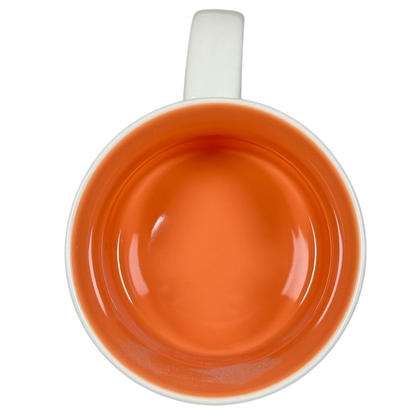 Top view of Starbucks Been There Tennessee mug with orange interior and white handle