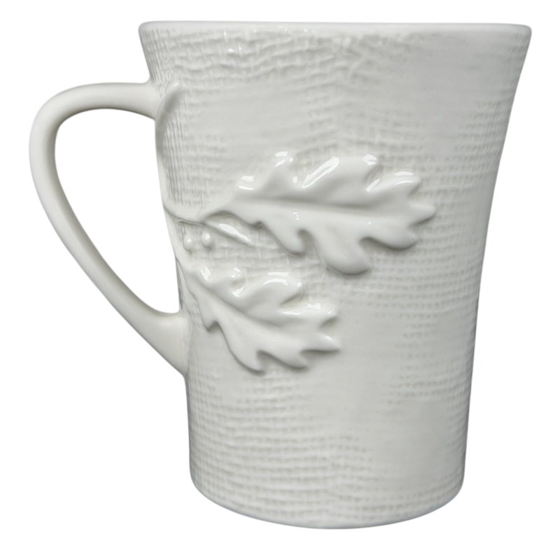 Starbucks burlap leaves acorns mug in white ceramic featuring textured details and leaf design