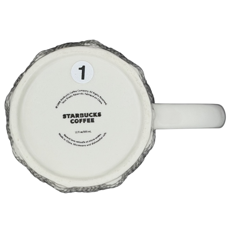 Bottom view of a Starbucks cable knit mug showcasing the logo and textured design
