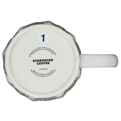 Bottom view of a Starbucks cable knit mug showcasing the logo and textured design