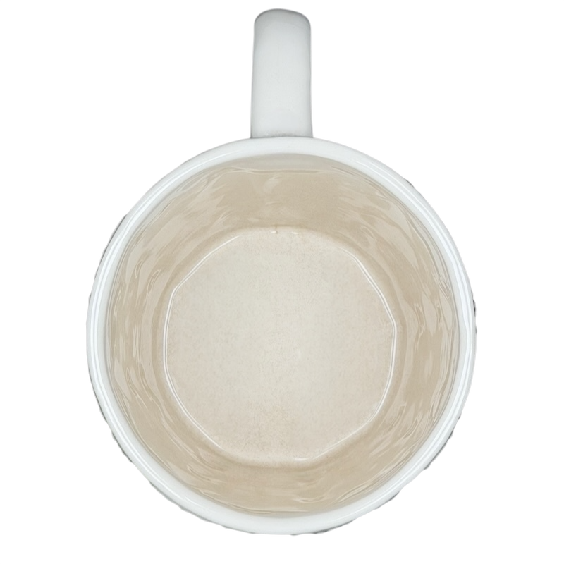 Inside view of a Starbucks cable knit mug with a smooth cream-colored finish