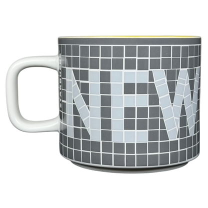 Collectible Starbucks subway tile mug featuring a modern design with the word NEW in light colors