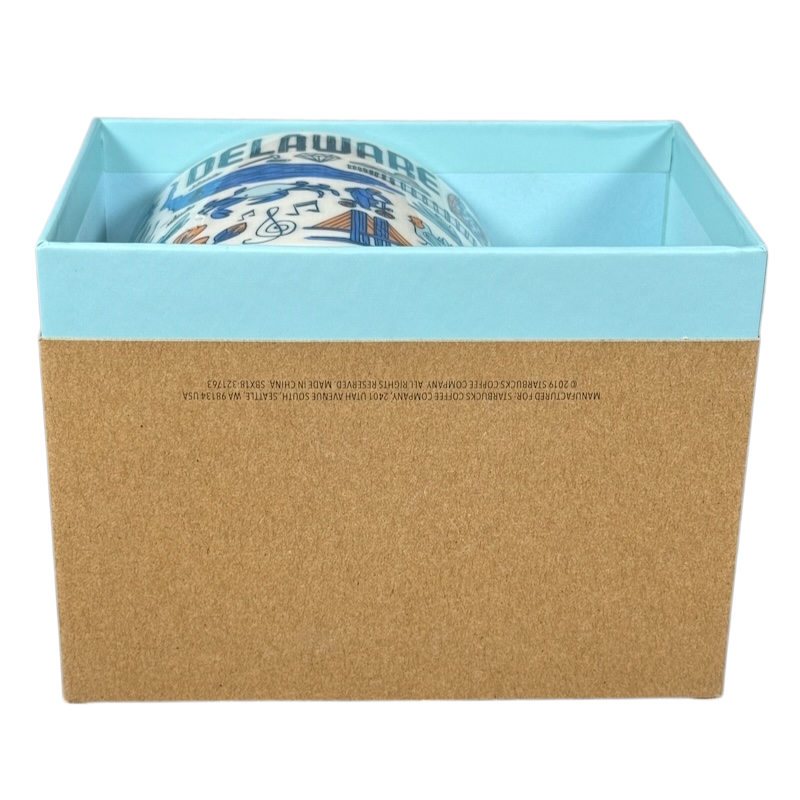 Starbucks Delaware Been There mug partially visible inside a blue and brown gift box