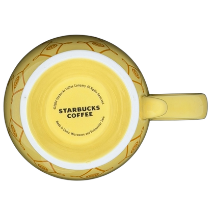 Top view of a Diamond Swirl Yellow Mug Starbucks featuring a bright yellow design with logo