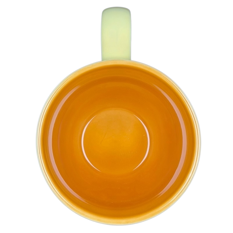 Top view of Diamond Swirl Yellow Mug Starbucks with vibrant orange interior and glossy finish