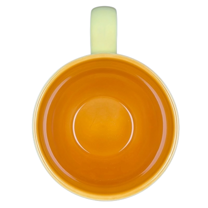 Top view of Diamond Swirl Yellow Mug Starbucks with vibrant orange interior and glossy finish
