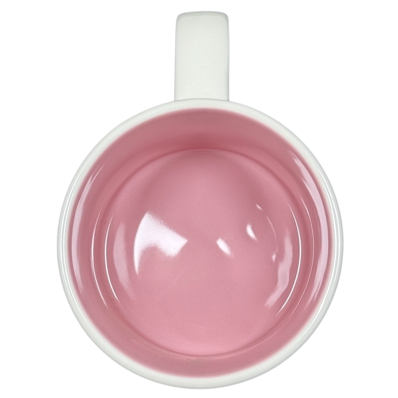 Top view of empty Disneyland Starbucks Been There Series mug with pink interior and white handle