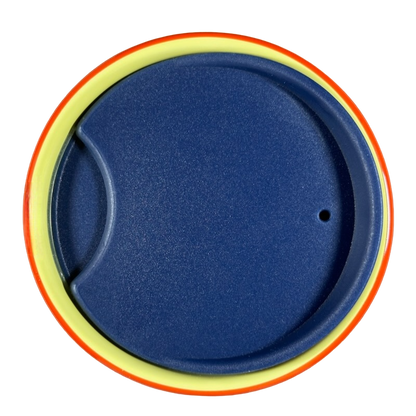 Top view of blue lid for Disneyland Minnie Mouse Starbucks tumbler with yellow and orange rim