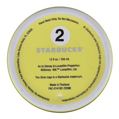 Bottom view of Disneyland Minnie Mouse Starbucks tumbler showing size and care instructions in yellow base