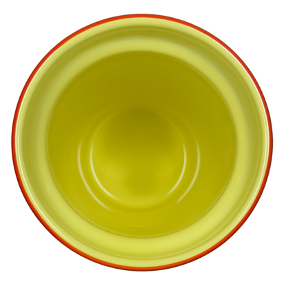 Top view of empty Disneyland Minnie Mouse Starbucks tumbler with yellow interior and orange rim