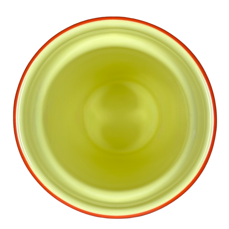 Top view of the Disneyland Minnie Mouse Starbucks tumbler with a yellow interior and orange rim