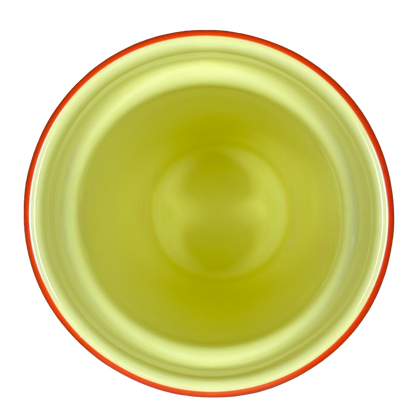 Top view of the Disneyland Minnie Mouse Starbucks tumbler with a yellow interior and orange rim