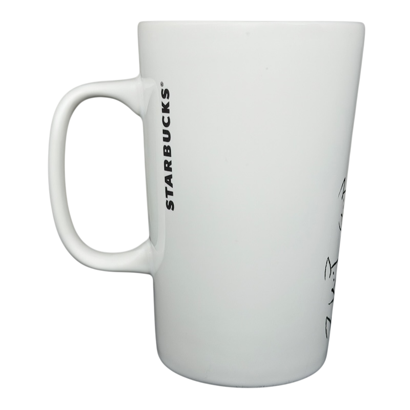 Starbucks dogs tennis ball collectible mug featuring a sleek white design and ergonomic handle