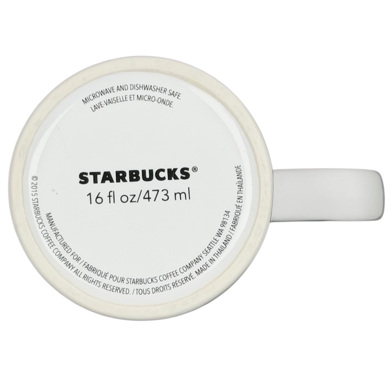 Bottom view of a Starbucks dogs tennis ball collectible mug showing volume and care instructions