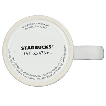 Bottom view of a Starbucks dogs tennis ball collectible mug showing volume and care instructions