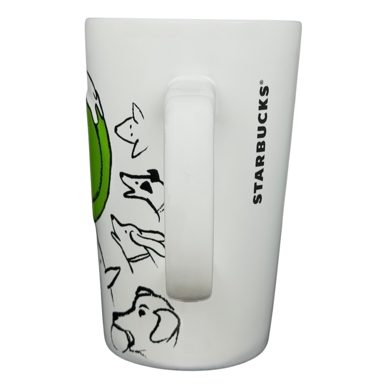 Starbucks dogs tennis ball collectible mug featuring playful dog illustrations on a white background