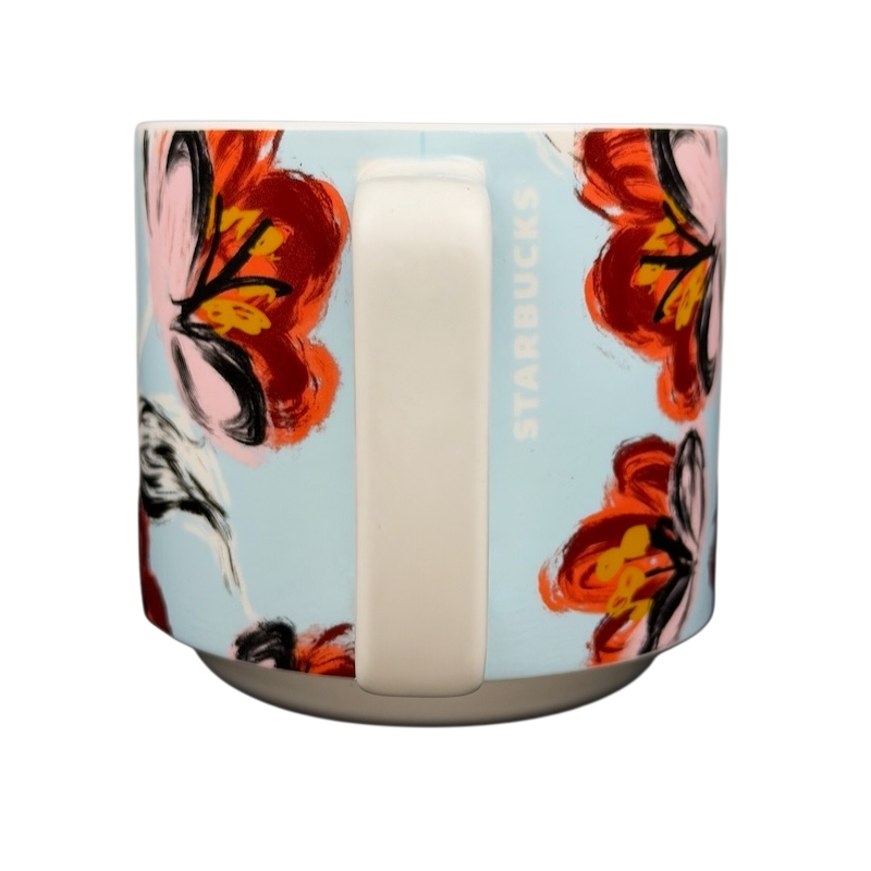 Starbucks floral abstract mug featuring vibrant floral designs against a light blue background
