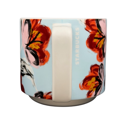 Starbucks floral abstract mug featuring vibrant floral designs against a light blue background