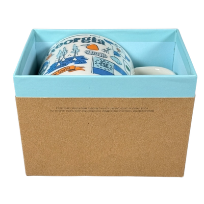 Starbucks Georgia Been There Series mug partially visible inside a blue and brown gift box