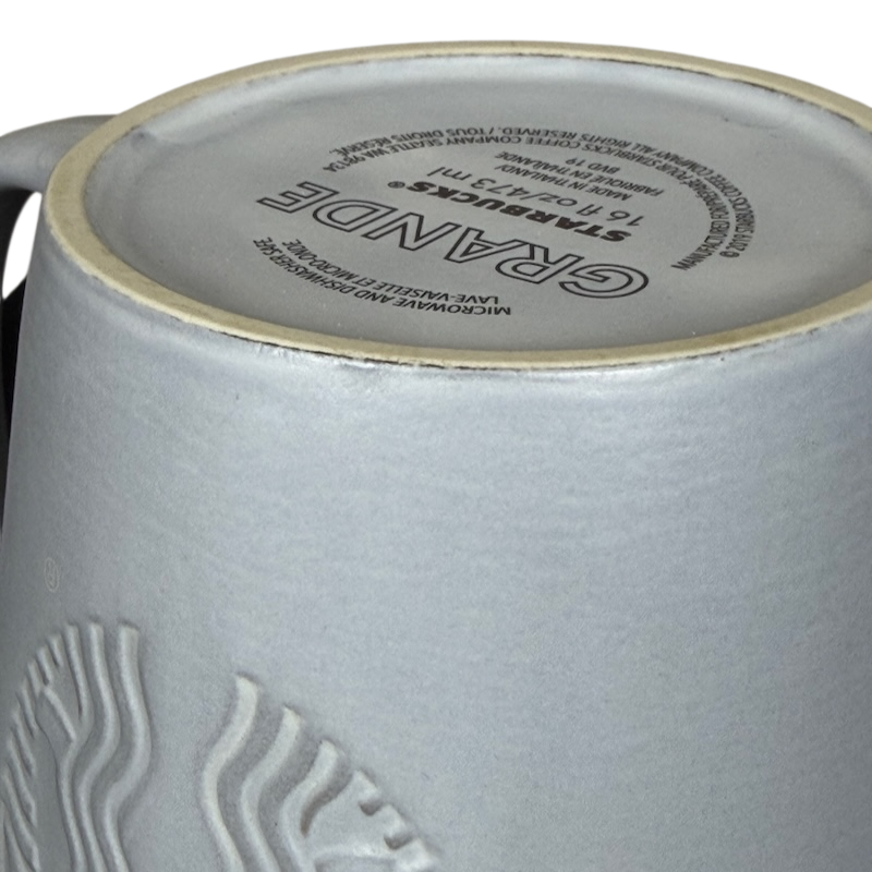 Close-up of the bottom of Grande Matte Gray Siren Collectible Mug Starbucks showcasing intricate design details